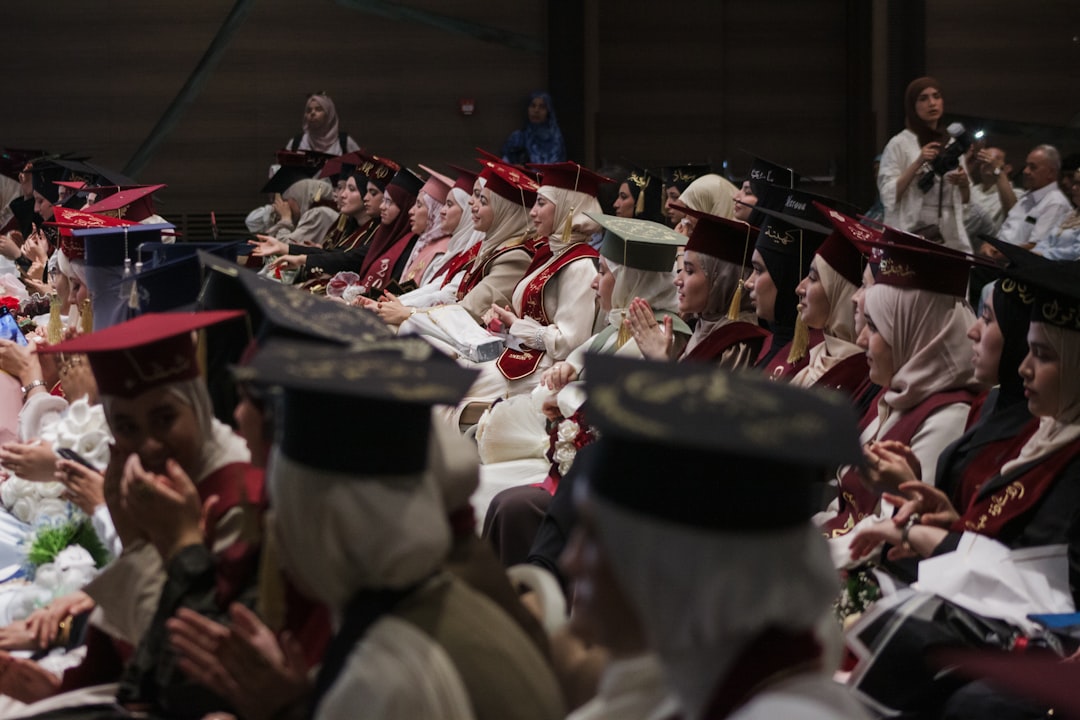 Nursing graduates in caps and gowns at a commencement ceremony after completing an accredited program