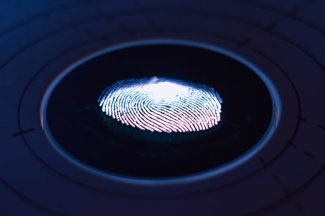 Fingerprint being captured on a biometric scanner for a background check