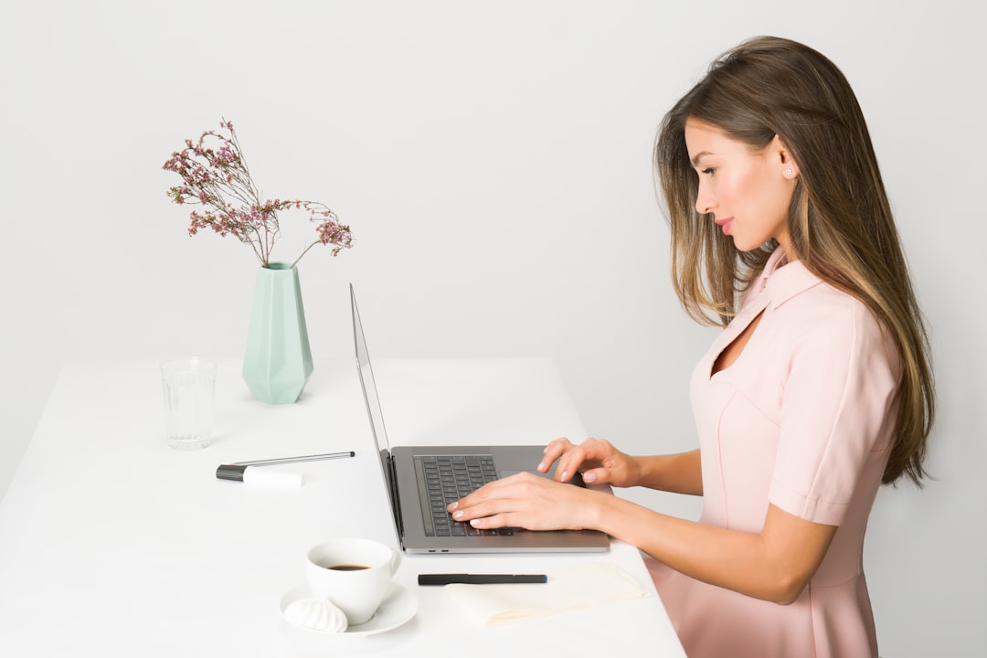 Nursing candidate working through practice questions on a laptop