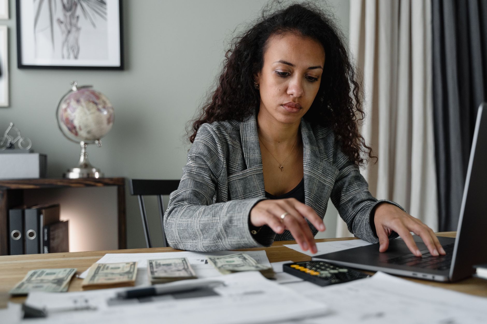 Nurse calculating the tuition cost and lost income of a Doctor of Nursing Practice program