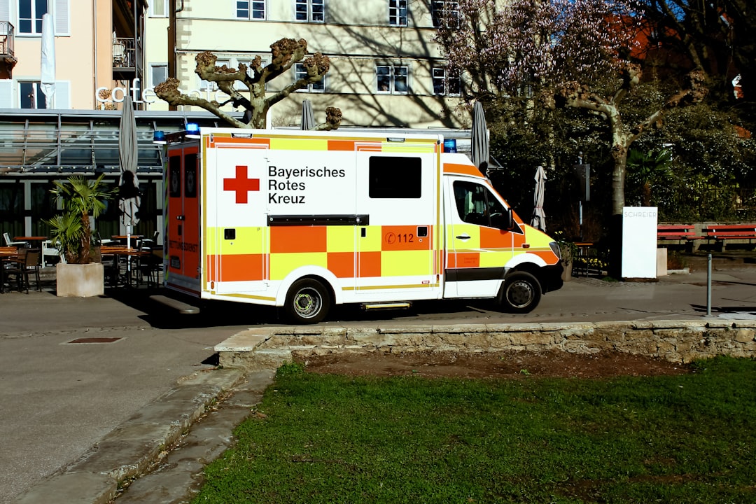 Ambulance parked outside a hospital emergency entrance where undifferentiated patients arrive