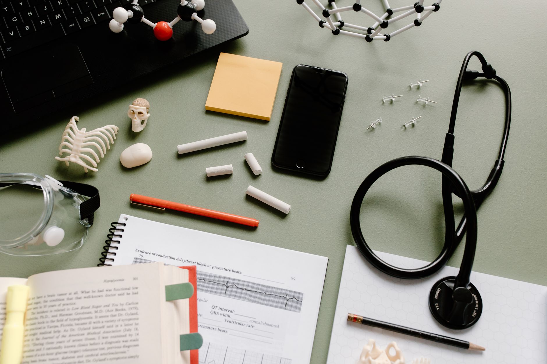 Study planner and notes laid out for building a HESI A2 entrance exam preparation schedule
