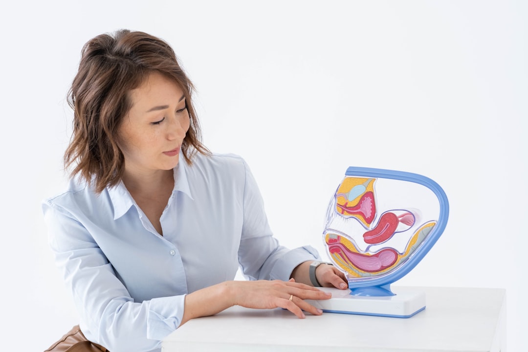 Nursing applicant reviewing an anatomy model while preparing for the HESI A2 A and P section