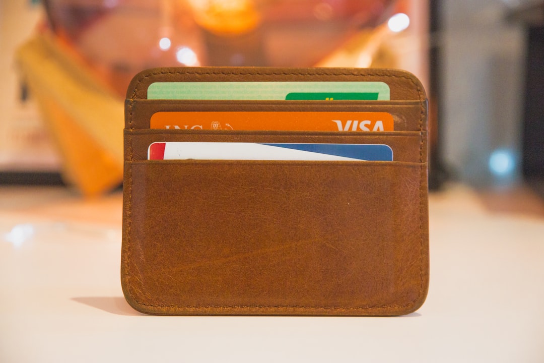 Wallet holding payment cards, used for non-refundable HESI A2 exam fees