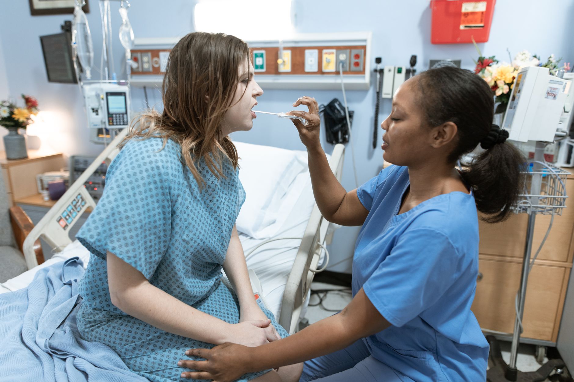 Nurse assessing a patient on a maternity unit, where every intervention affects mother and baby