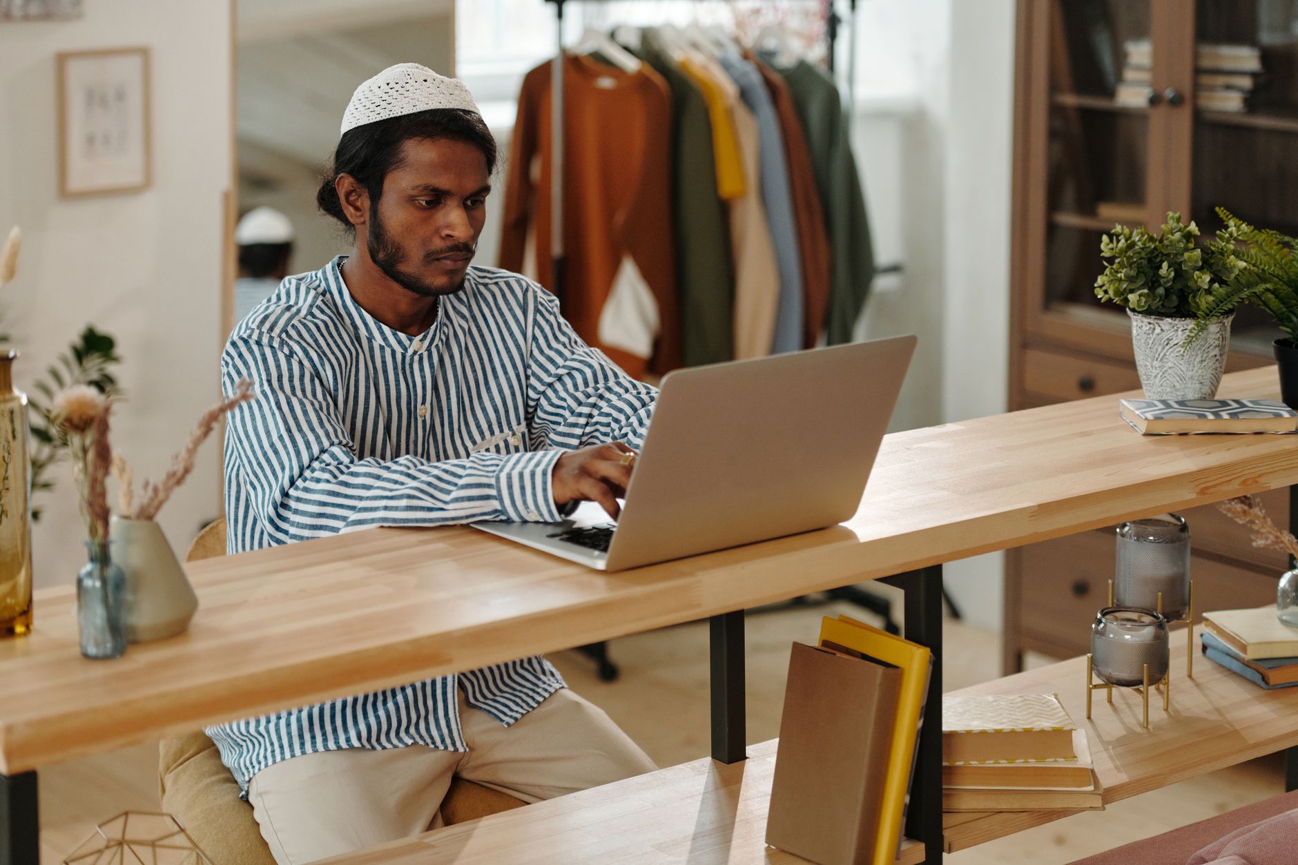 Student at a home desk preparing for a remotely proctored HESI A2 testing session