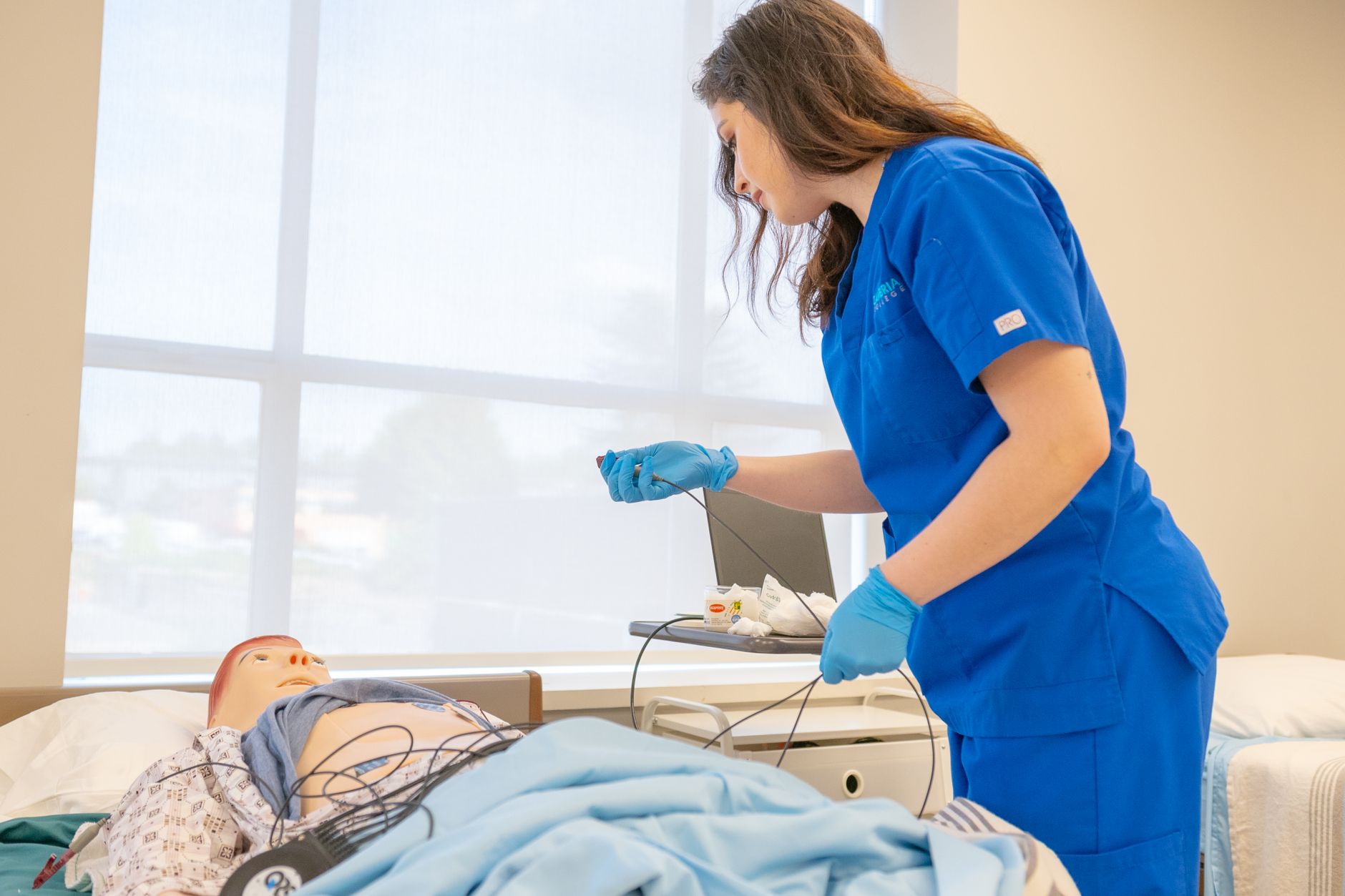 Nursing student reviewing Blue Book–style flashcards for the NCLEX