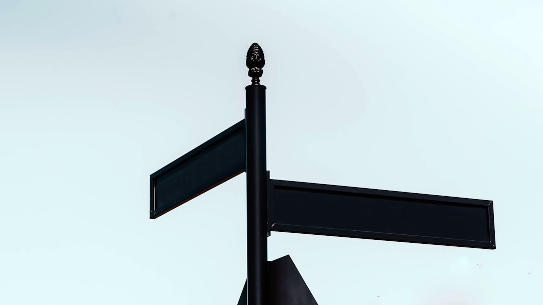 Blank signpost pointing in two directions, illustrating the choice of which NCLEX guide to read next