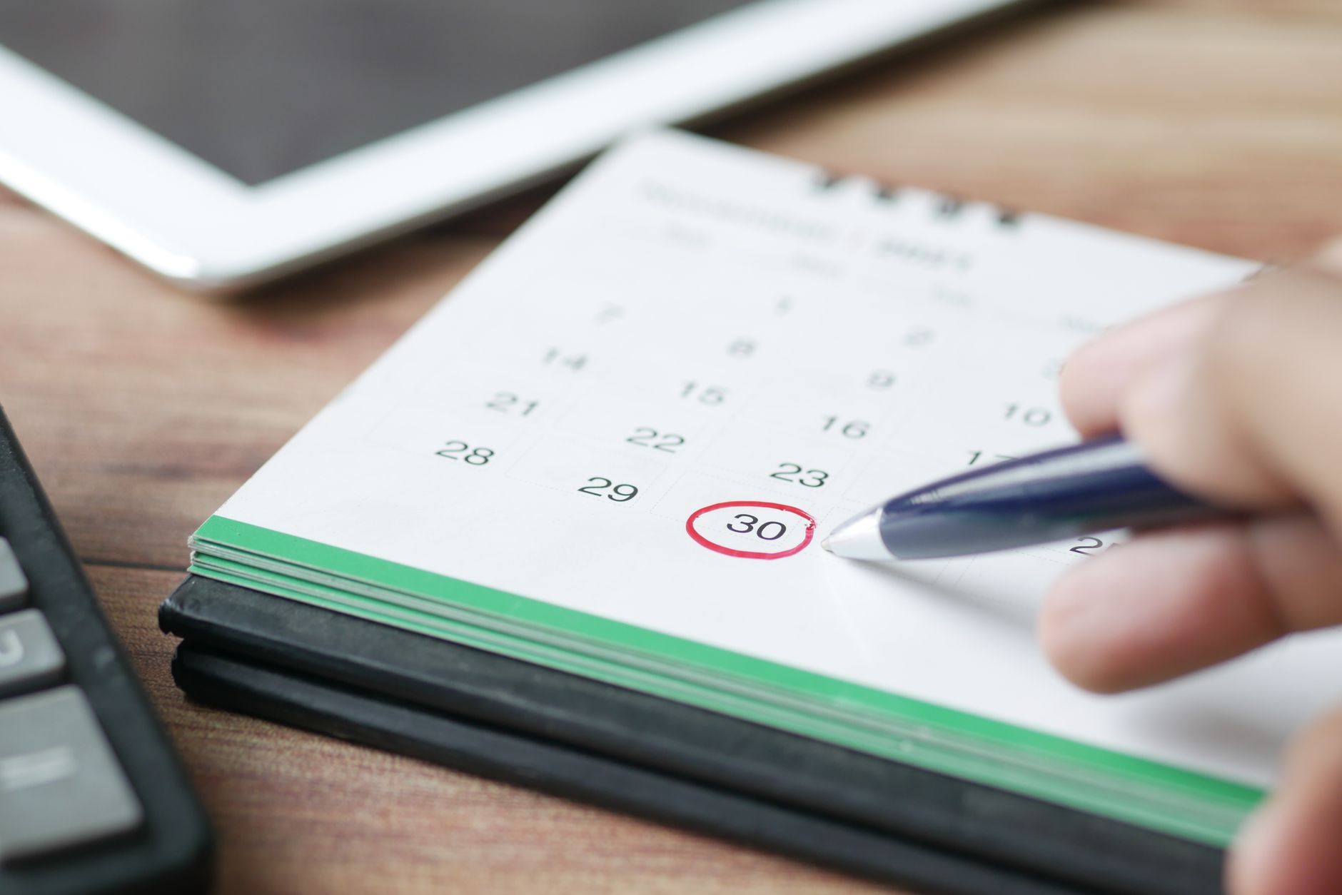 Marking a calendar to plan the mandatory waiting period before an NCLEX retake