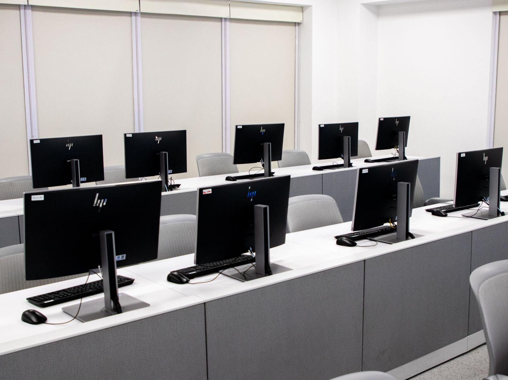 Rows of partitioned computer workstations in a testing center, where the NCLEX-RN is delivered as a computer adaptive test