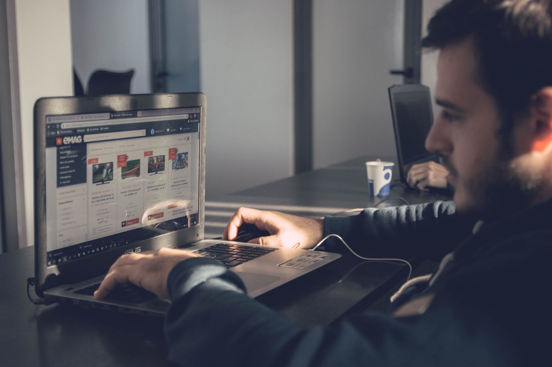 Person running a database search on a laptop to check license status