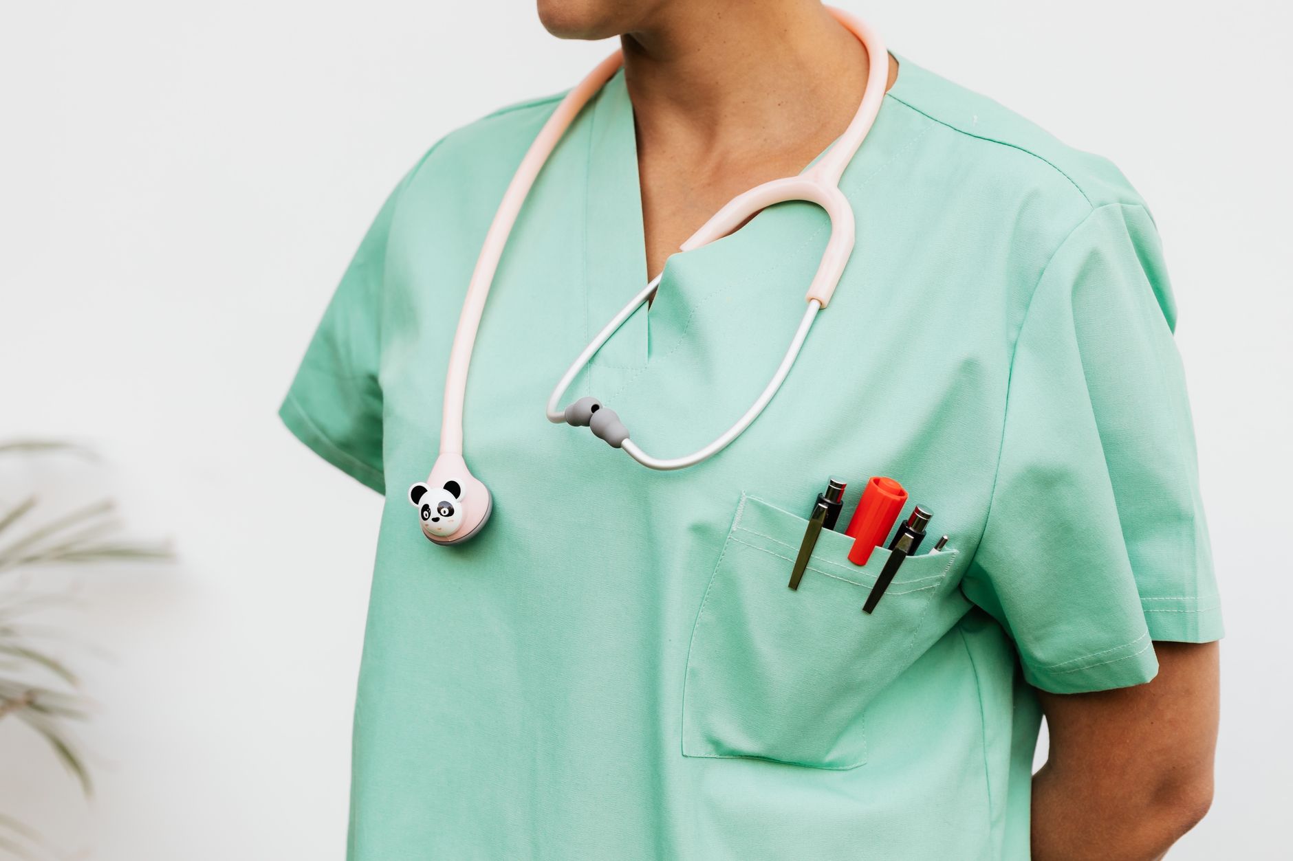 Nursing student equipment including scrubs and a stethoscope, costs rarely shown in tuition figures
