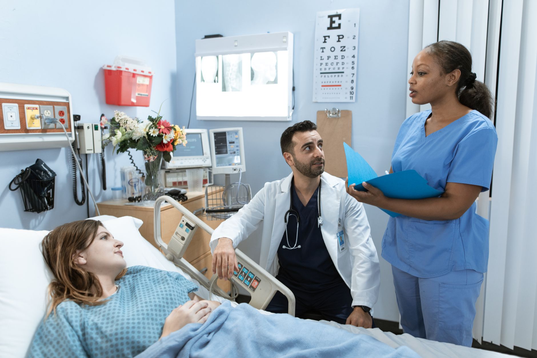 Nurse talking with a patient on an inpatient unit during a mental health assessment