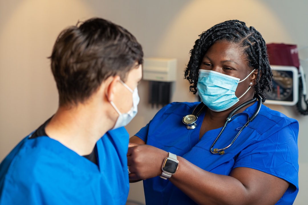 A registered nurse and a practical nurse working together in a hospital