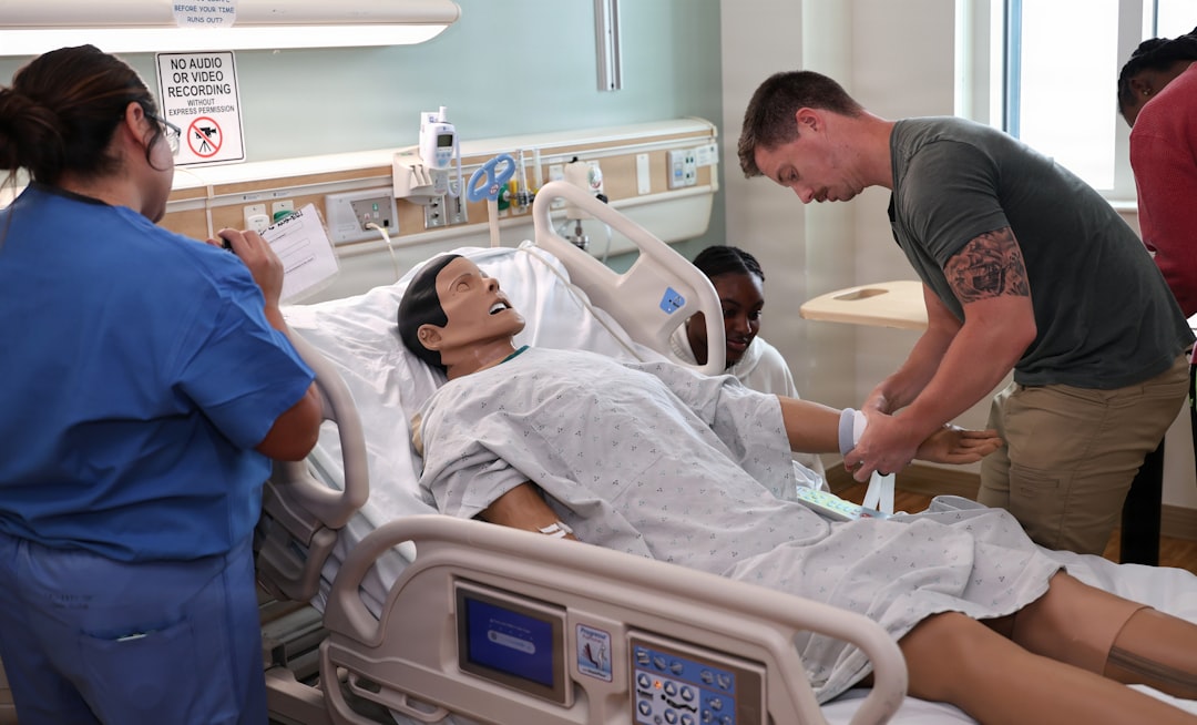 Clinicians practicing resuscitation on a manikin in a simulation lab